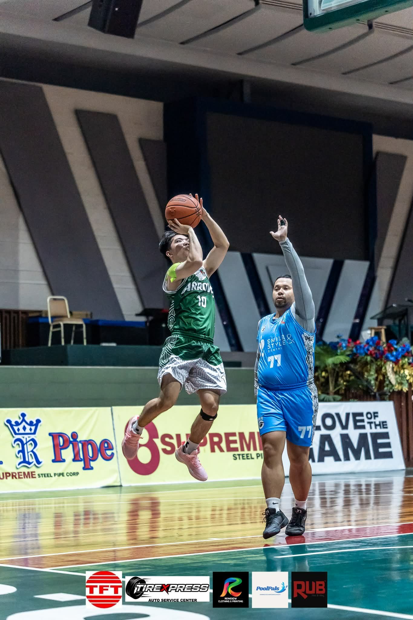 Player elevating for a jump shot over a defender