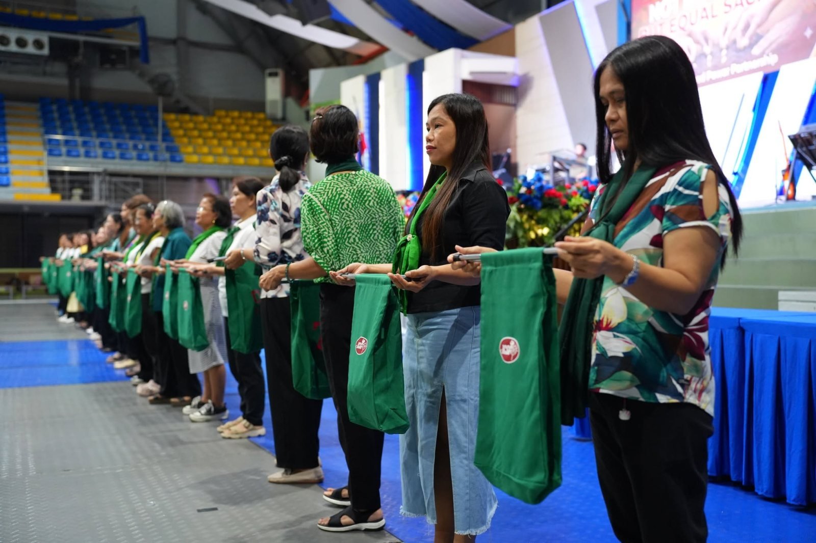 JCSGO congregation members holding offering bags during a giving ceremony